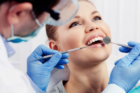 Dentist checking patients teeth